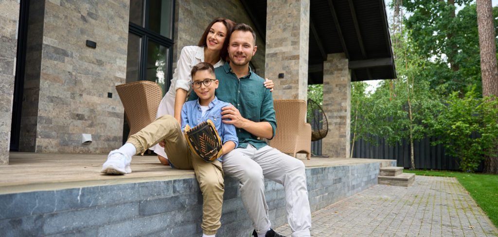 Mom, dad and son, hugging, settled down on the terrace, financial situation, preservation age, loan, investing, holiday home, super balance, specific rules of extra contributions, tax benefits, investment strategy