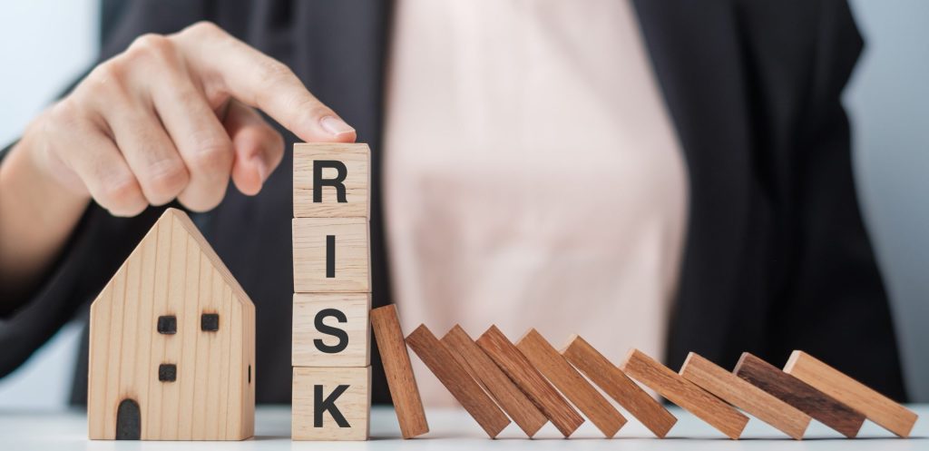 Businessman stop falling wooden blocks and protect house model, investment strategy, investing, managed super fund smsf, fund members, loan repayments, property purchase, commercial real estate, stamp duty, smsf borrowing, investment purposes, cash flow, higher costs, investment returns, annual audit